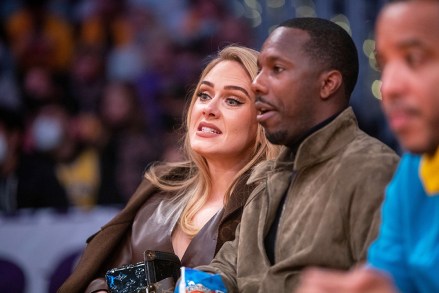 Singer Adele and sports agent Rich Paul attend a game between the Golden State Warriors and the Los Angeles Lakers on October 19, 2021 at STAPLES Center in L.A. Celebrities attend Los Angeles Lakers v Golden State Warriors, Staples Center, Los Angeles, California, USA - 19th October 2021